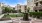 a courtyard with trees and buildings