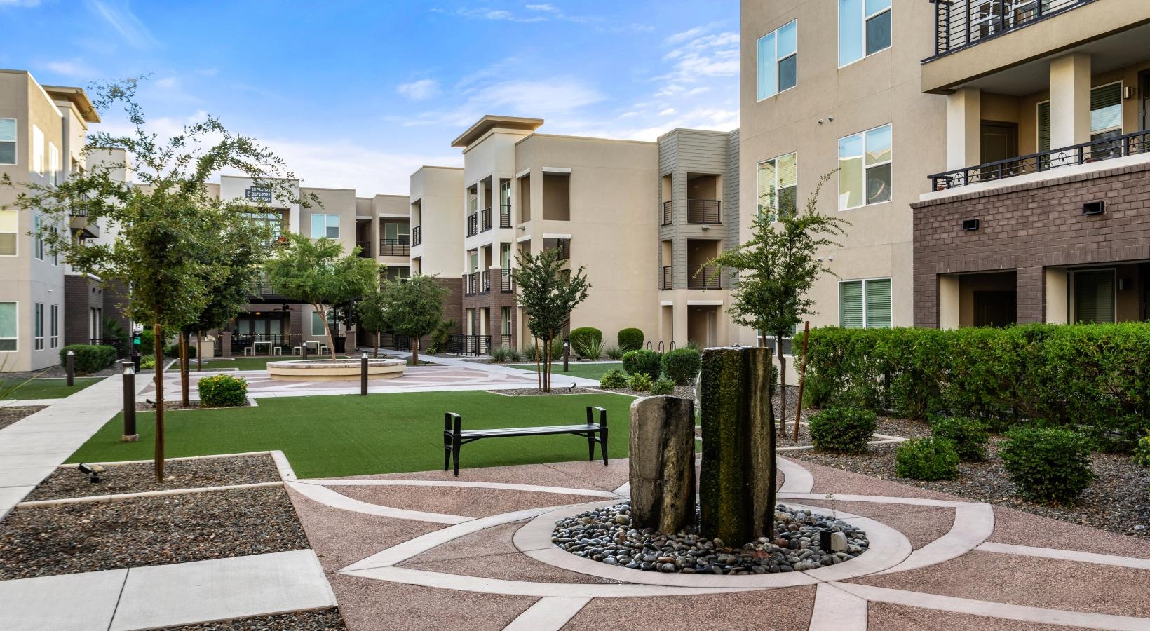Find your perfect fit at Harper a courtyard with trees and buildings