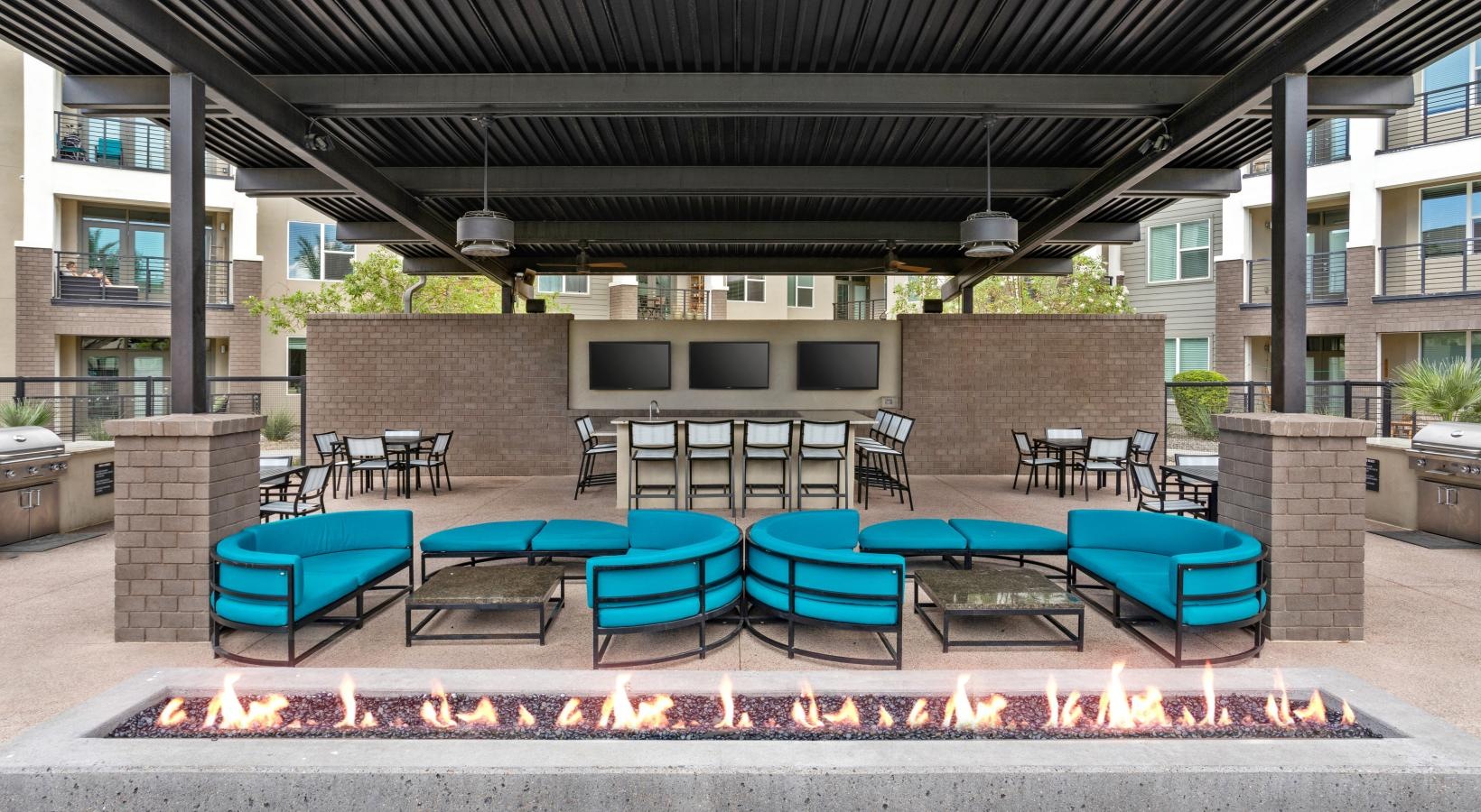 Access to resident-only features a patio with chairs and tables