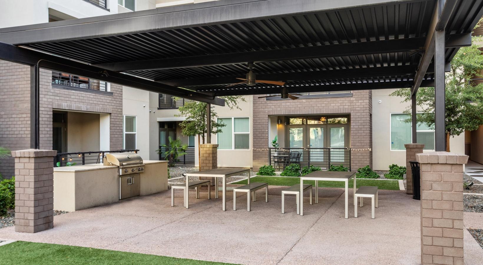 Enjoy our resident-only features a building with a patio and tables