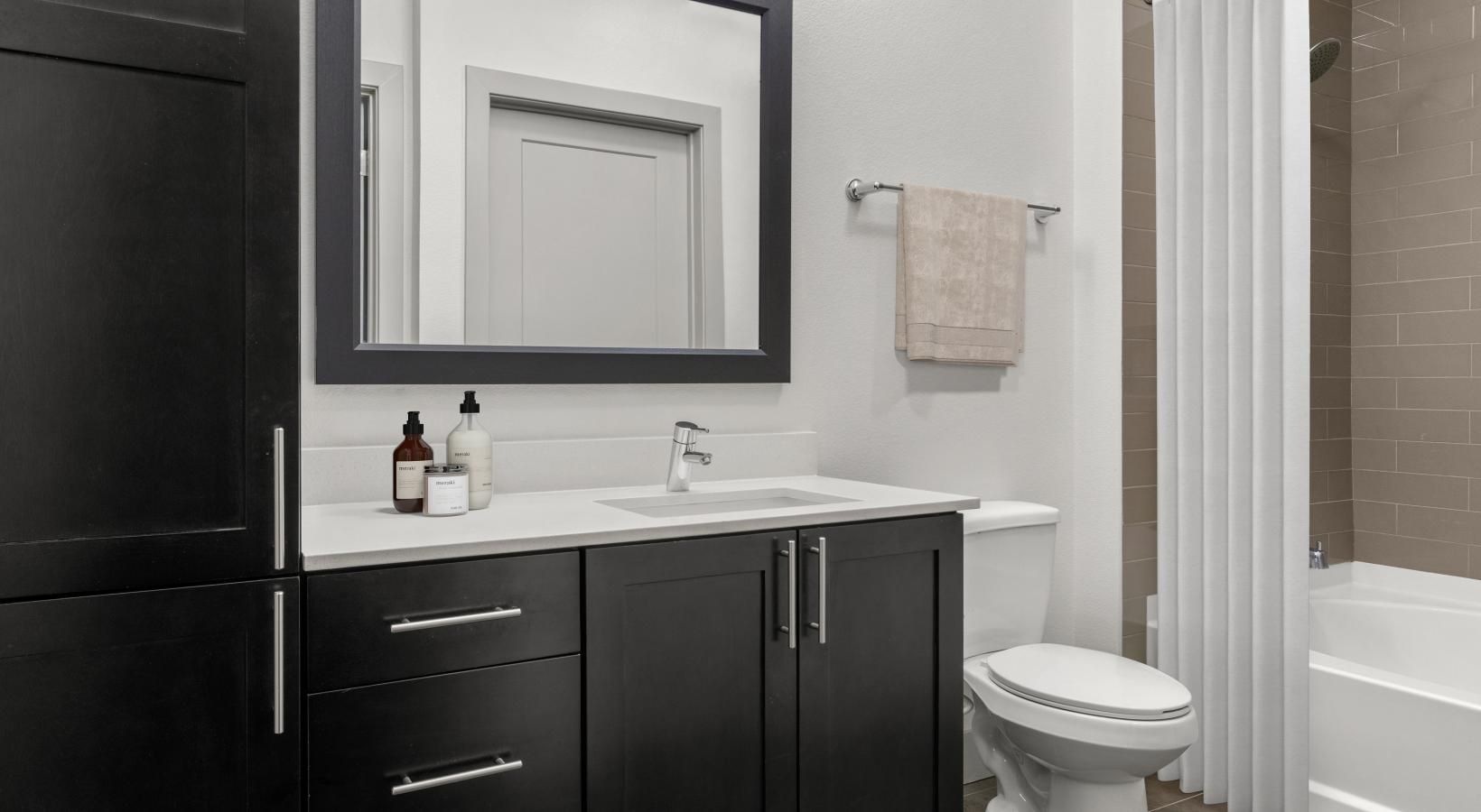 Bathroom options with thoughtful details a bathroom with a sink toilet and bathtub
