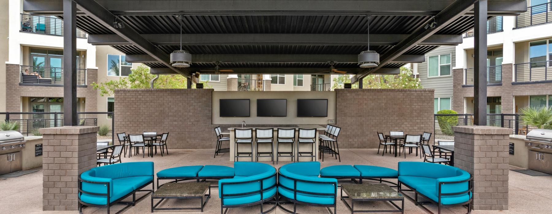 a patio with chairs and tables