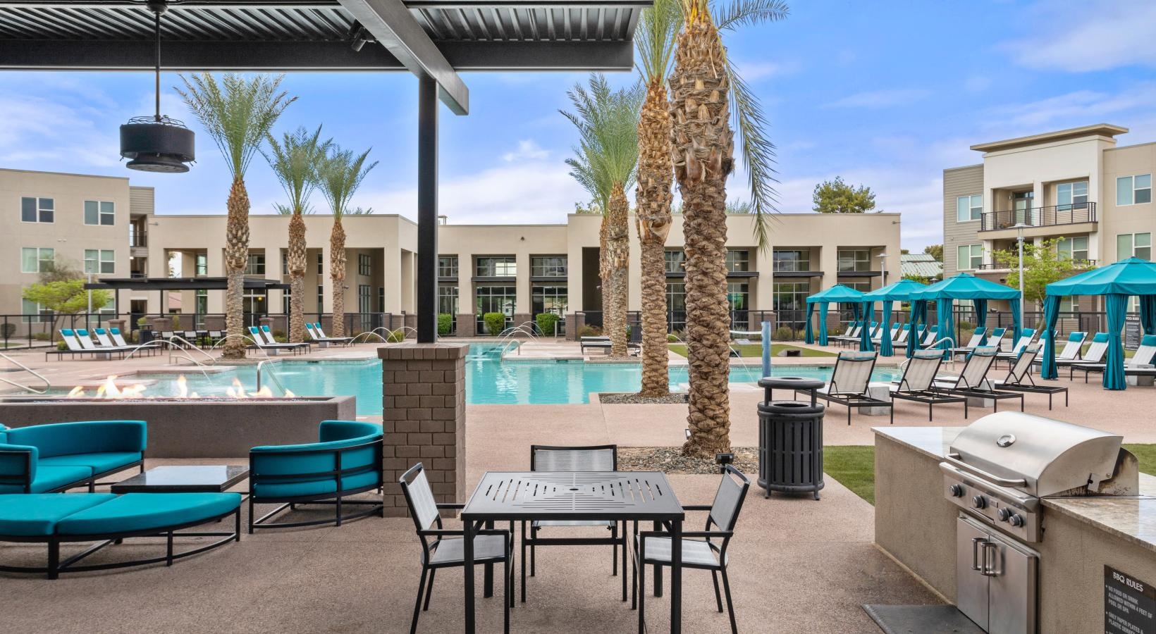 Enjoy our resident-only features a pool with chairs and tables