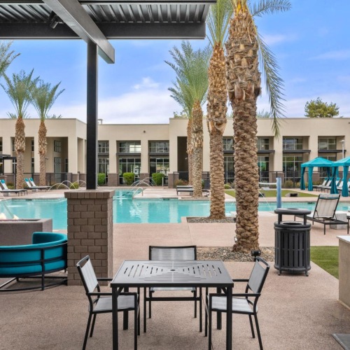Enjoy our resident-only features a pool with chairs and tables