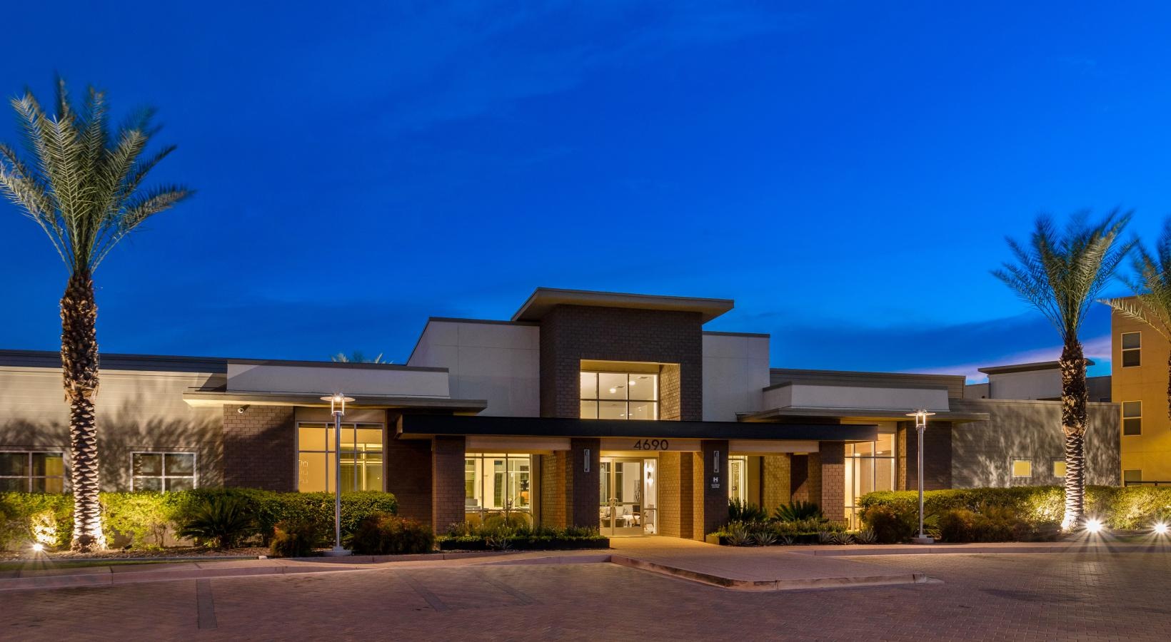 Settle into comfort at Harper a building with trees in front of it