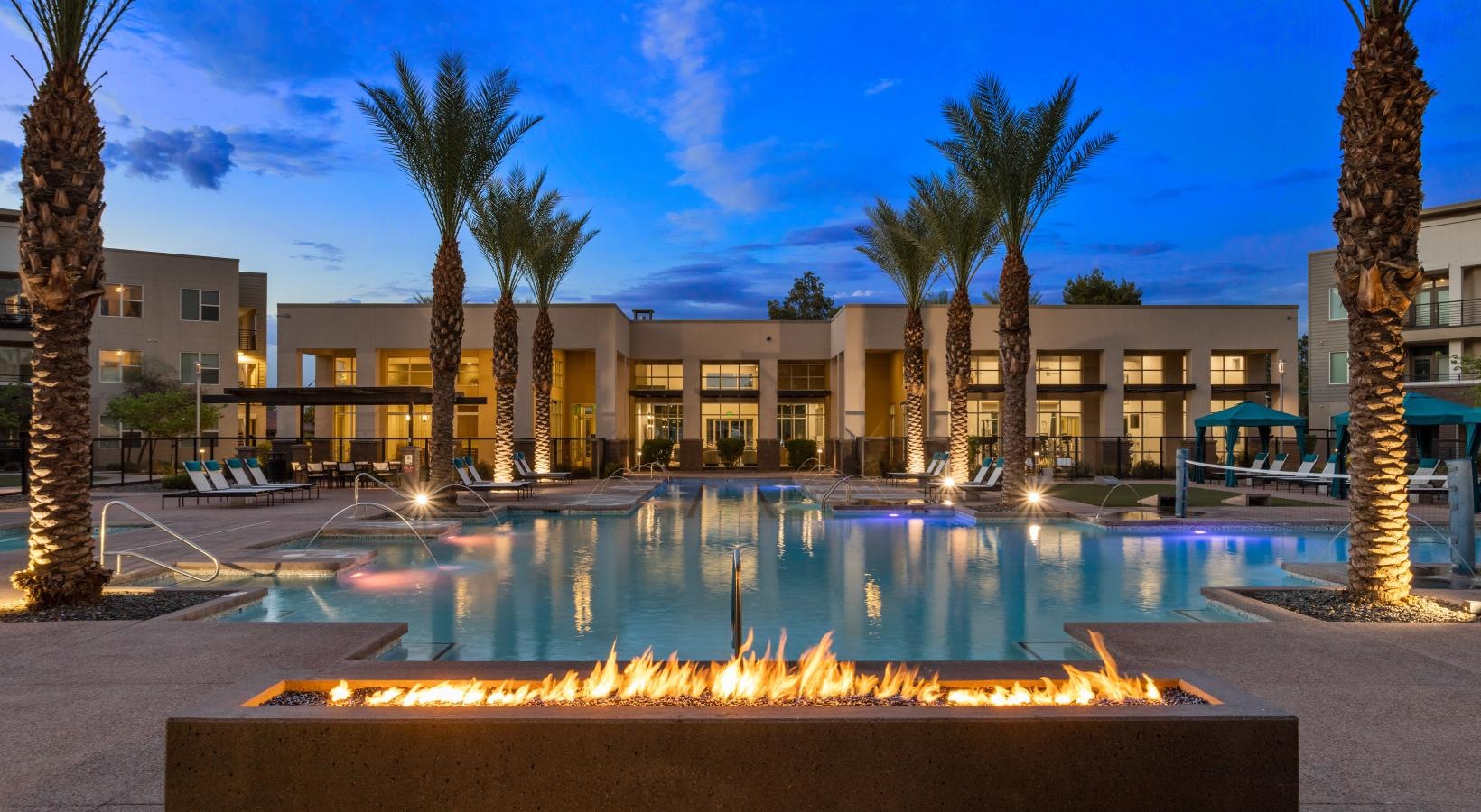 Sparkling swimming pool a fountain in front of a building